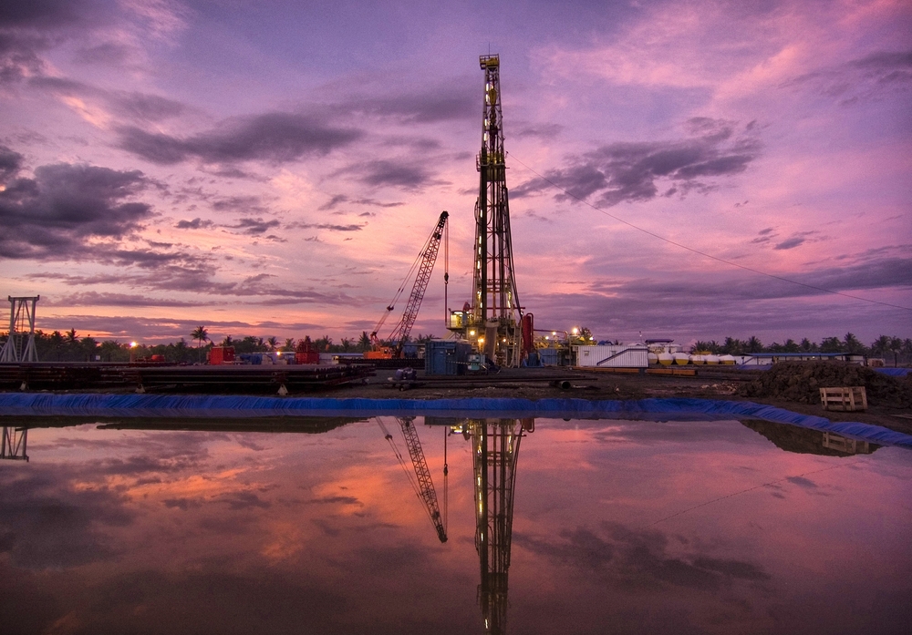 Oil drilling rig at dusk