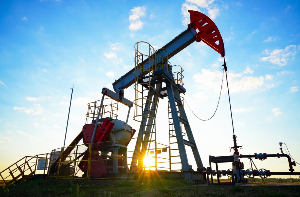 Oil pump jack at sunset